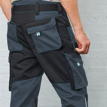 Load image into Gallery viewer, Back view of the hardwearing Kobelco Workwear Trousers featuring two cargo side pockets with flaps and two back pockets with Velcro fastening. 

